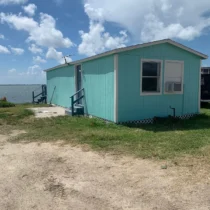 quit wishing go fishing waterfront cabin exterior