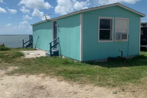 quit wishing go fishing waterfront cabin exterior